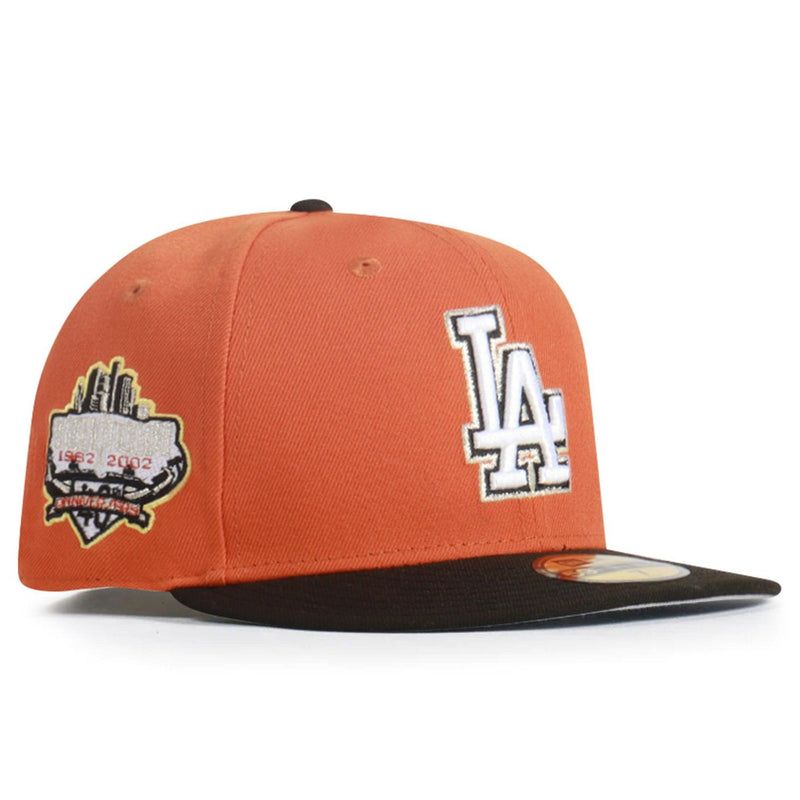 Orange baseball cap with logos on a white background