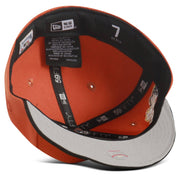 Orange and gray cap with brand labels on a white background