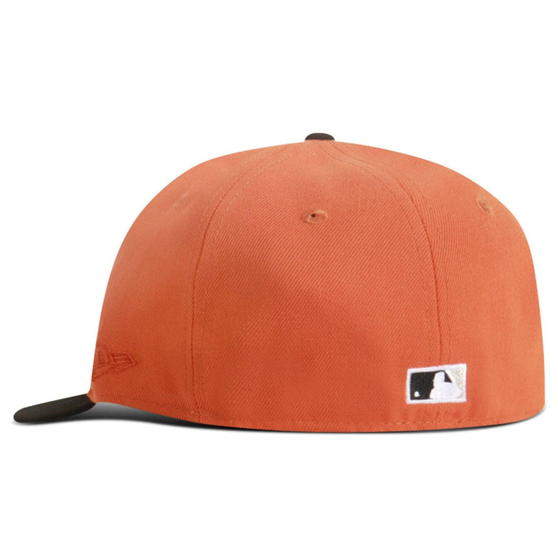 Orange baseball cap with a logo on a white background