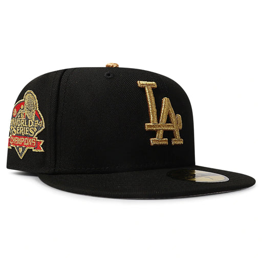 Black baseball cap with gold LA logo on a white background