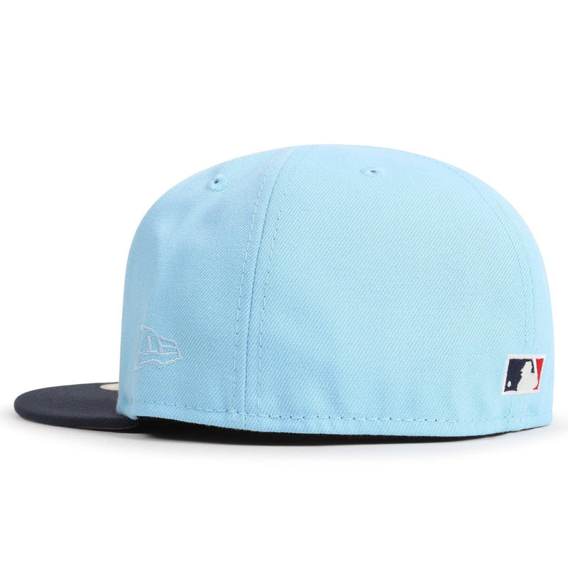 Light blue cap with a black brim on a white background